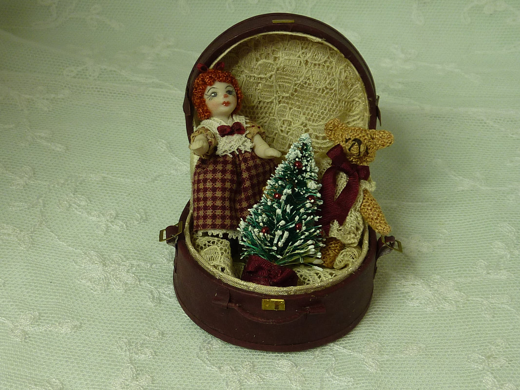 Christmas doll in a hat box
